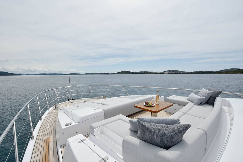 Seating area and sunbathing cushions on bow