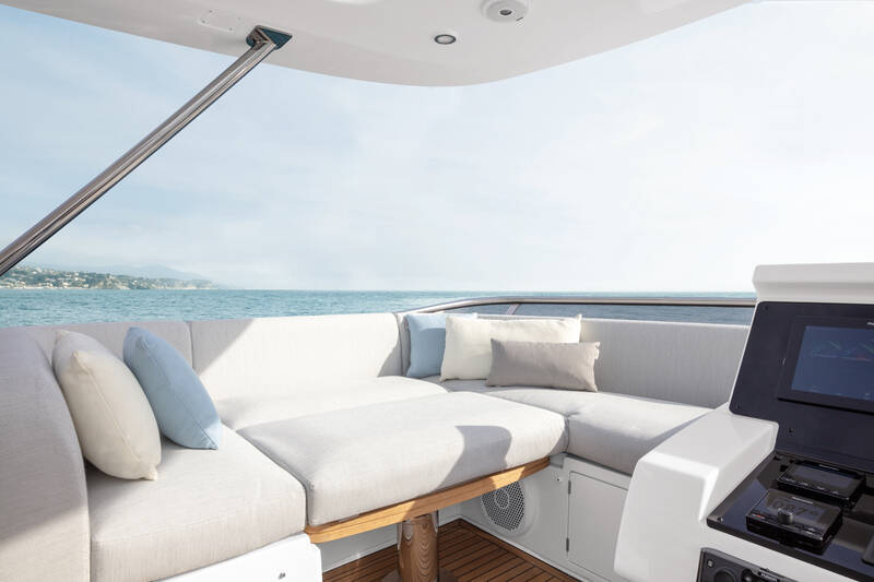 Seating area next to helm station on flybridge