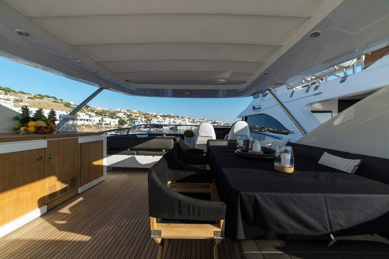 Dining area with wet bar on flybridge